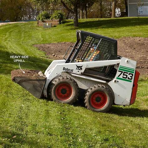 operating skid steer on hill|how to load a skid steer.